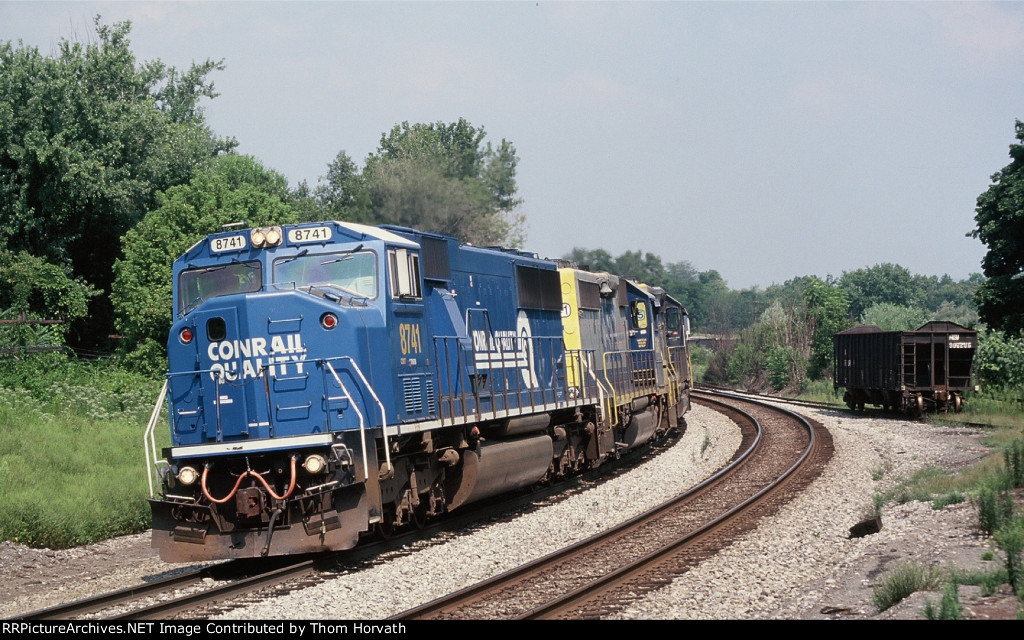 CSX 8741 wears its former paint scheme with a consist of mixed freight